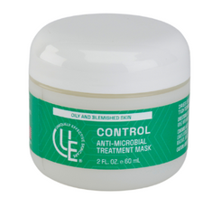 2 oz. jar of Uniquely Effective Skincare's Control Anti-Microbial Treatment Mask with its creamy clay texture and fresh botanical elements, zinc, and sulfur—highlighting its powerful blemish-fighting and oil-balancing properties for oily and acne-prone skin.