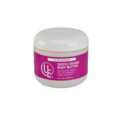 4 oz. jar of Uniquely Effective Skincare's Deeply Devine Body Butter, with a thick, creamy texture emphasizing deep hydration and skin-softening nourishment for dry, cracked areas.