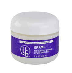 2 oz. jar of Uniquely Effective Skincare’s Erase Non-Abrasive Exfoliating Cream with fresh papaya, pineapple slices, and aloe—highlighting its gentle enzyme-based exfoliation for sensitive and blemish-prone skin