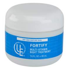 A 2 oz jar of Uniquely Effective Skincare’s Fortify Multi-Vitamin Night Cream  with a smooth, rich cream featuring vitamin-rich ingredients like avocado, carrot, and sea buckthorn, symbolizing its deep hydration and overnight renewal benefits for dry and mature skin.
