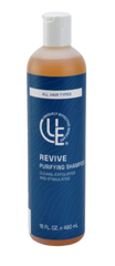 Clear 16 ounce bottle of Revive prep and purify hair and scalp cleanser  with clean, fresh aesthetic—shown with aloe, seaweed, and botanical ingredients for a detoxifying, soothing cleanse.