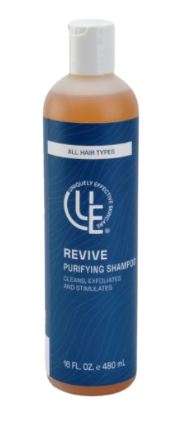 Clear 16 ounce bottle of Revive prep and purify hair and scalp cleanser  with clean, fresh aesthetic—shown with aloe, seaweed, and botanical ingredients for a detoxifying, soothing cleanse.